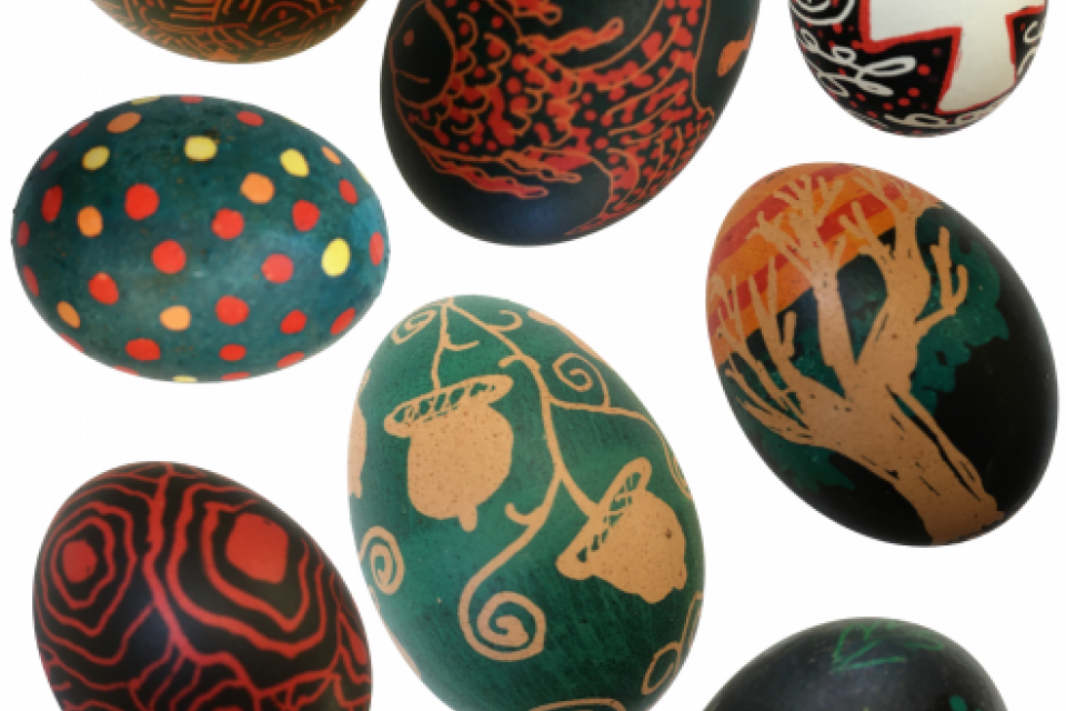 a layout of 8 colorful eggs decorated with wax designs