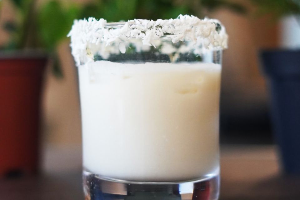 The Pina Colada is in a glass rimmed with coconut flakes! 