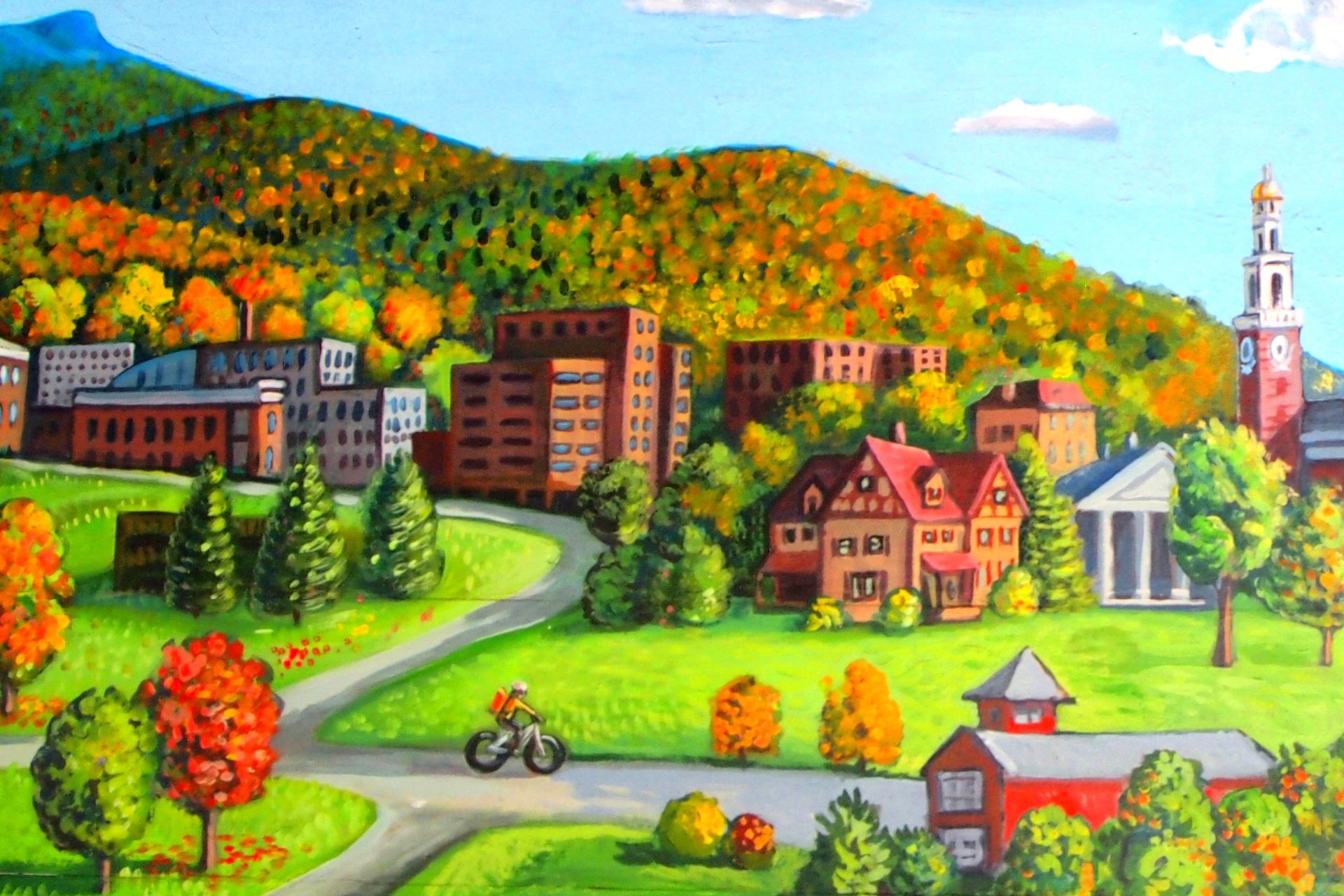 Mural painting with roads, buildings and trees on a rolling fall foliage landscape