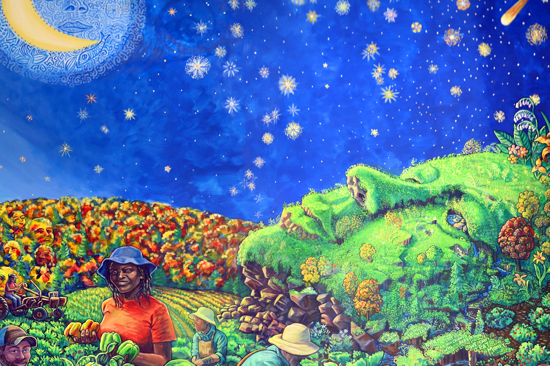 Mural painting with a woman's face looking up disguised as a bright green hillside on the right, farmers harvesting crops with a fall floliage landscape on the left, and a starry blue night spanning the top of the scene