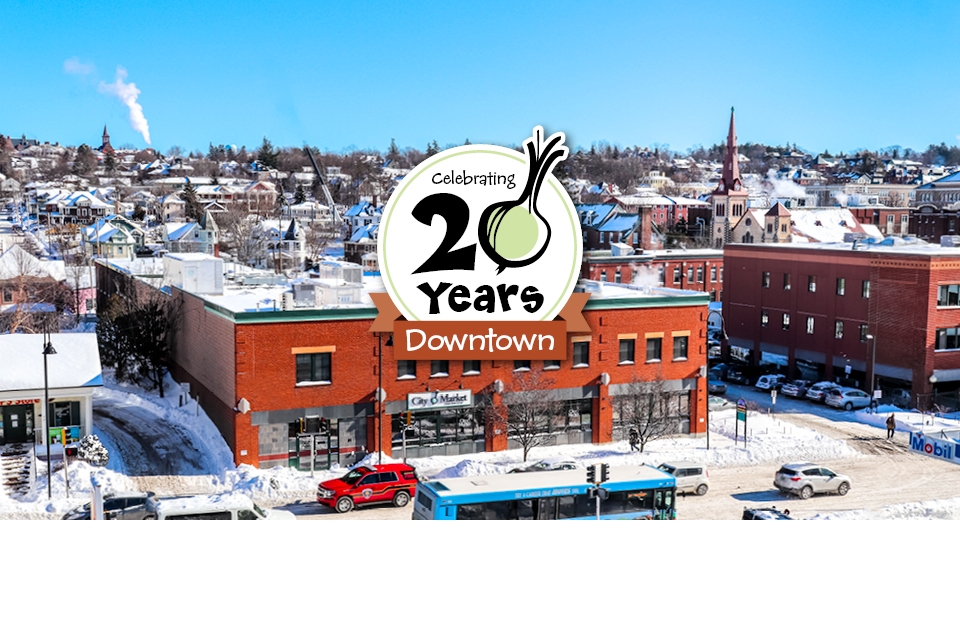 Photo of City Market's Downtown location with 20th Anniversary logo