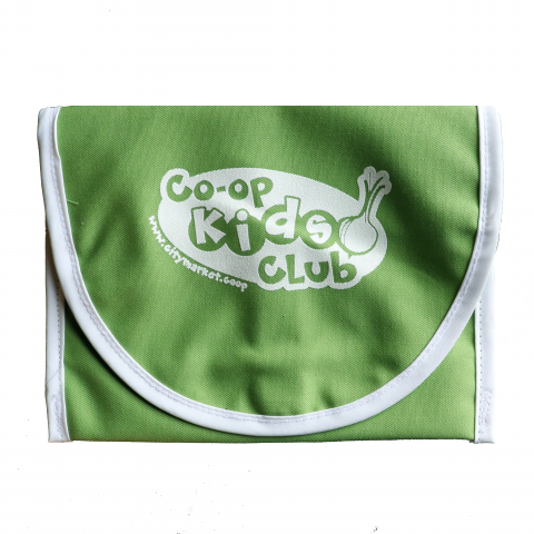 A green cloth pouch with a white logo for the Co-op Kids Club.