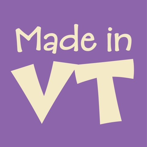 A lavender square with the words "Made in VT" printed on it in cream-colored text.