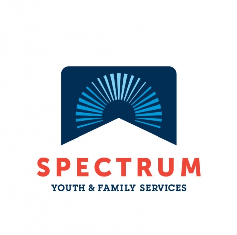 An arch of light blue bars of varying widths arrayed over a dark blue rectangle. The bottom of the rectangle has a white triangle cut out of it. Below the rectangle, the word "Spectrum" is written in orange capital letters. The words "Youth and Family Services" are printed below that in smaller, dark blue capital letters