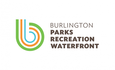 A lowercase "b" made of green, orange and blue stripes is on the left side. To the right, the words "Burlington Parks Recreation Waterfront" are printed in dark brown letters.