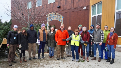 A group of employees and member workers who helped unload the trees! 