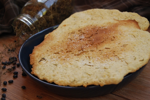 a plain flatbread on a dark-colored bowl