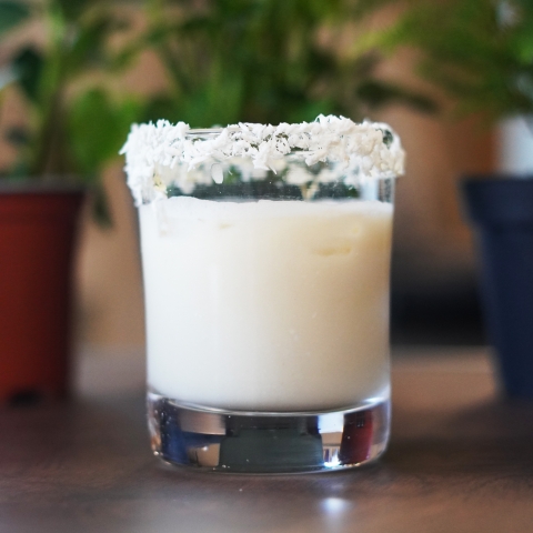 The Pina Colada is in a glass rimmed with coconut flakes! 