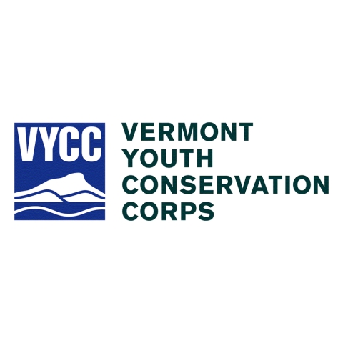 The VYCC logo. The words VYCC appear over a stylized Camel's Hump Mountain. To the right in green text "Vermont Youth Conservation Corp" is spelled out