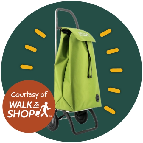 A photo of a bright green Walk to Shop Trolley on a dark green circle.