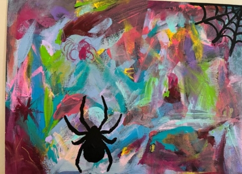 A blue, purple, green, and orange abstract background. In the foreground are a black spider left of center at the bottom of the canvas, and a black spider web in the top right corner