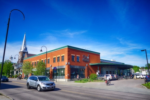 Exterior of City Market's downtown location on a bluebird day