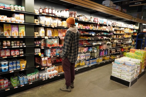 A male shopper in the breakfast aisle