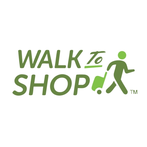 A logo in shades of green with the words Walk to Shop and a drawing of a person pulling a trolley cart behind them.