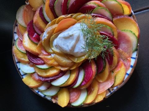 A platter of sliced peaches swirled