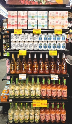 non alcoholic beverage cans and bottles on a shelf