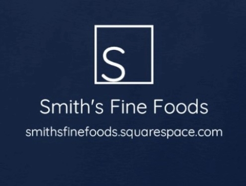 A white square with a white letter S in the bottom left corner of the square. Below that is "Smith's Fine Foods" and the URL for their website in white. This is all on a navy blue background.